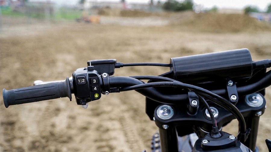Handlebar power mode selector switch showing modes 1 through 4